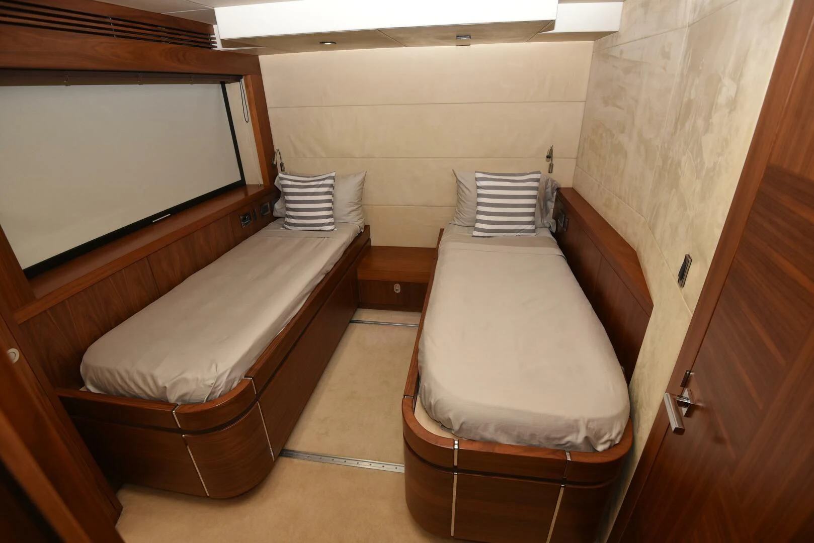 a couple of beds in a room aboard SAVI II Yacht for Sale