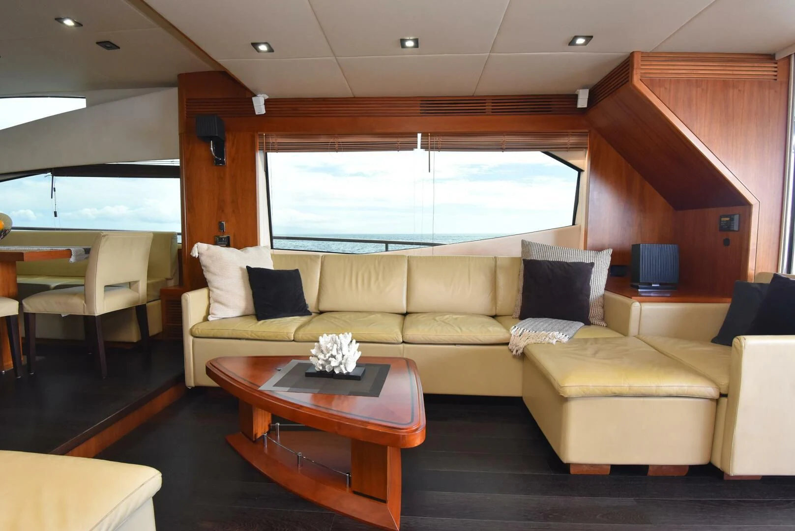 a living room with a couch and a coffee table aboard SAVI II Yacht for Sale