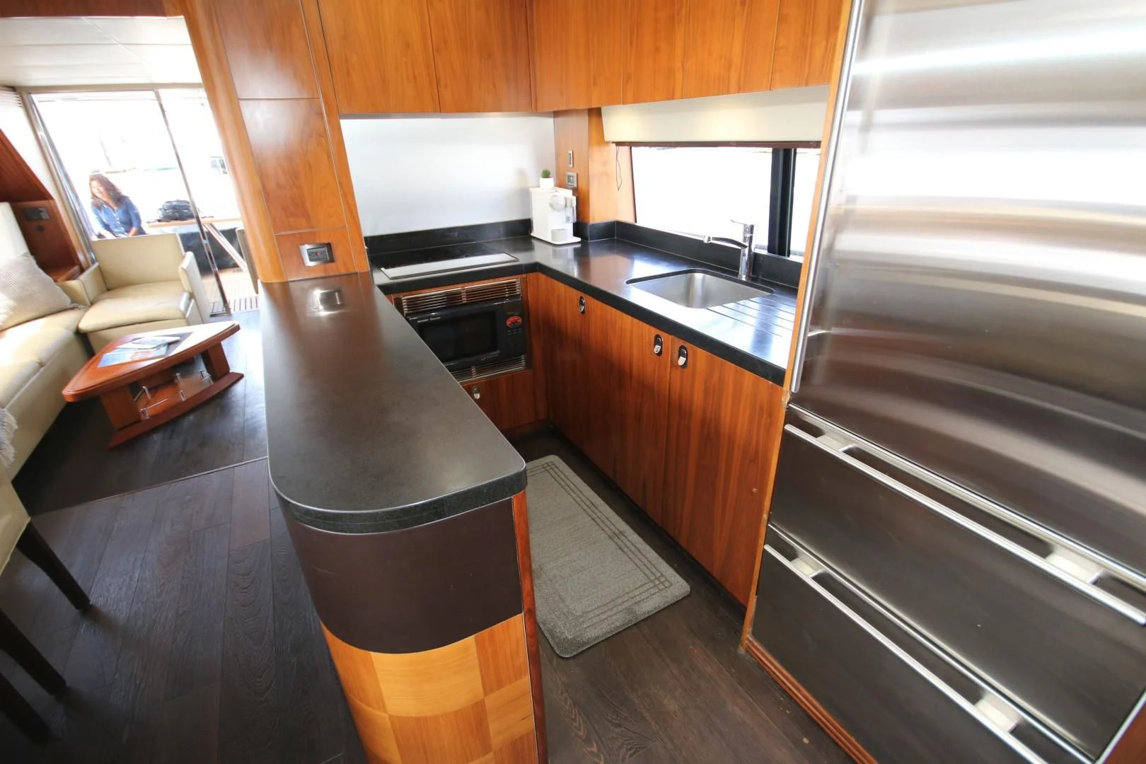 a kitchen with a black counter aboard SAVI II Yacht for Sale