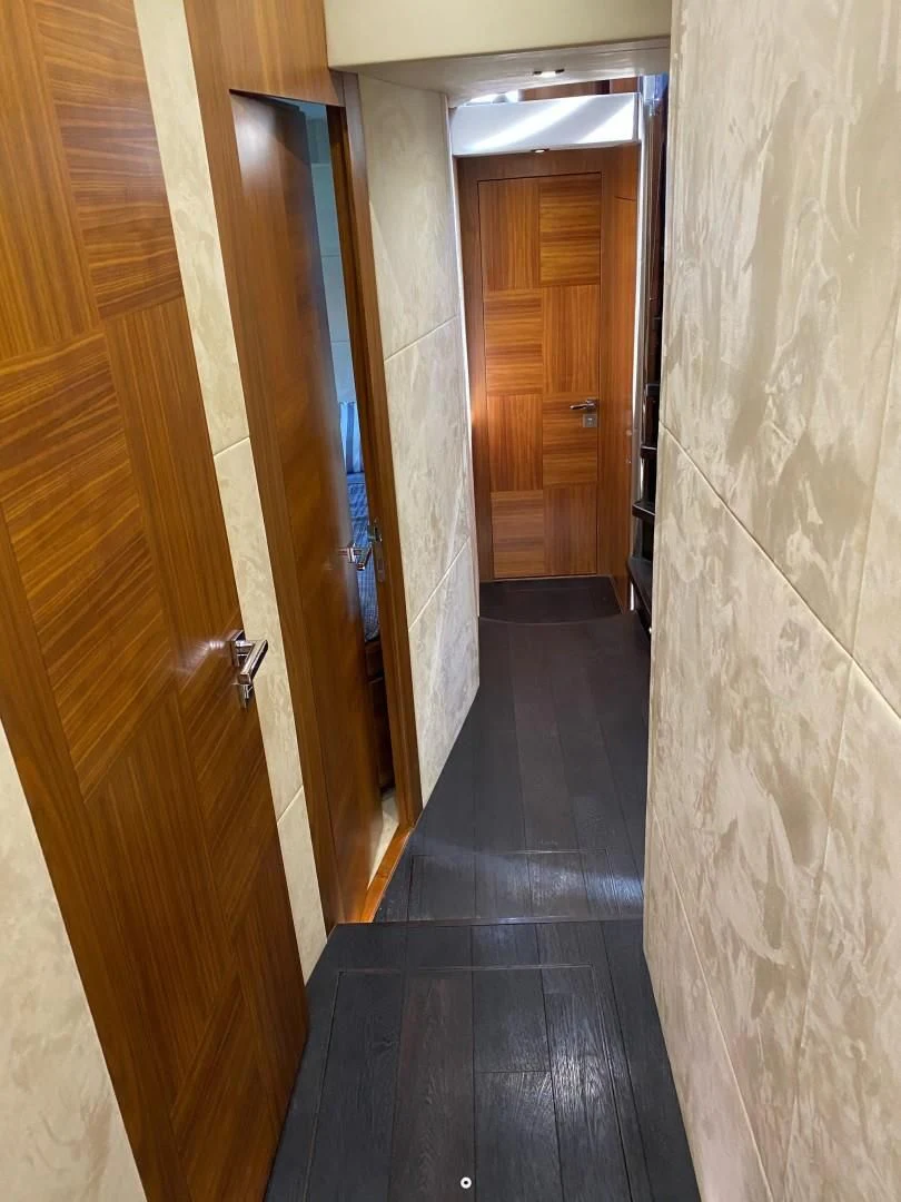 a hallway with doors aboard SAVI II Yacht for Sale