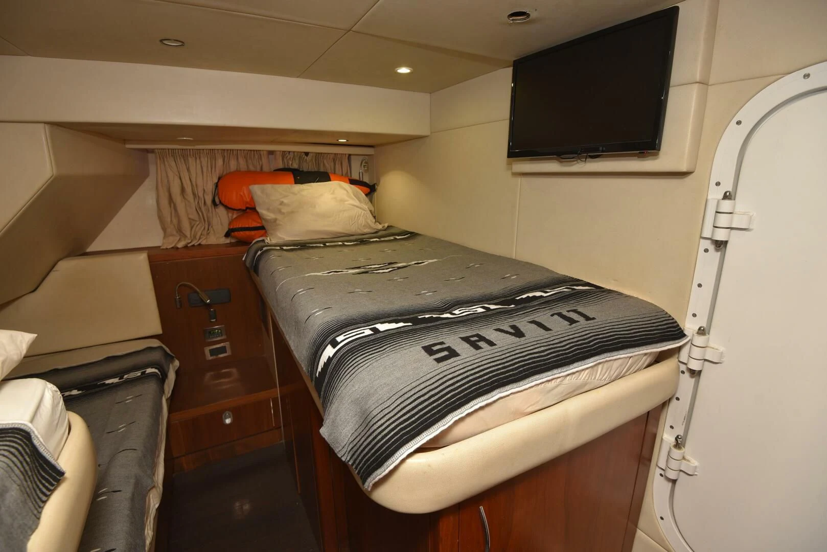 a bed in a room aboard SAVI II Yacht for Sale