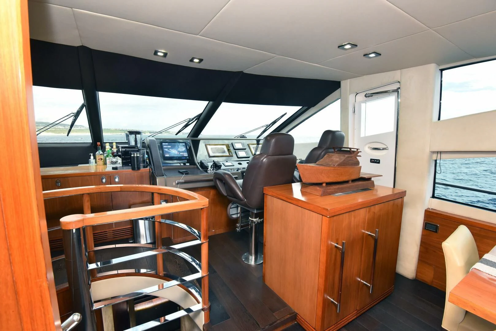 inside of a vehicle with desks and chairs aboard SAVI II Yacht for Sale