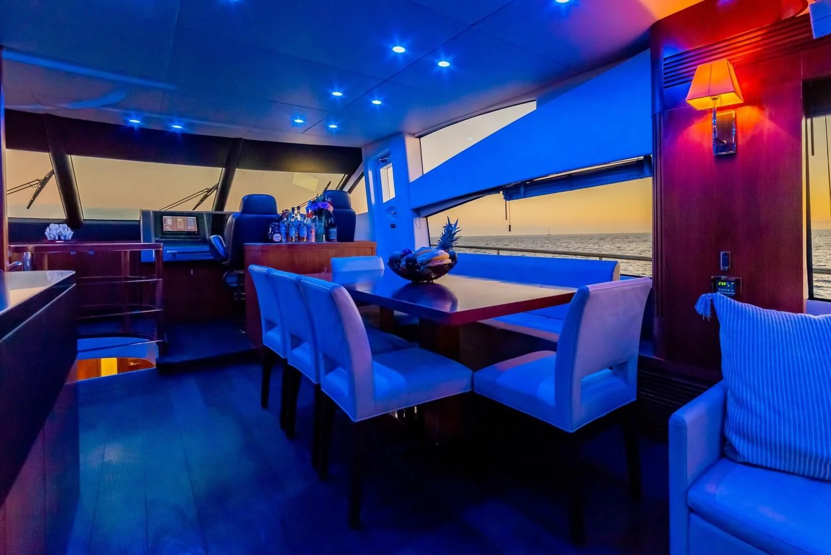 a room with a table and chairs aboard SAVI II Yacht for Sale