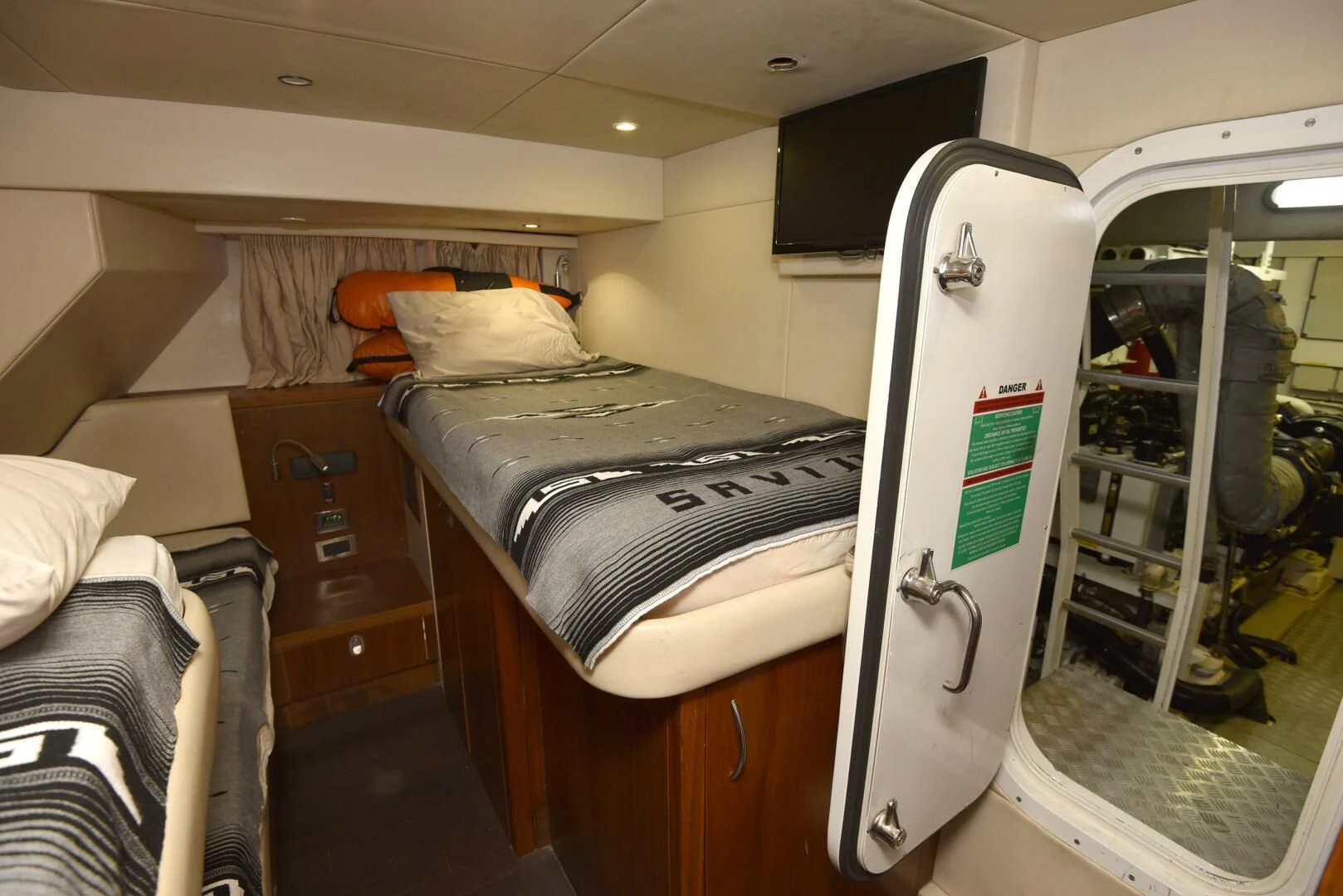 a bed in a room aboard SAVI II Yacht for Sale
