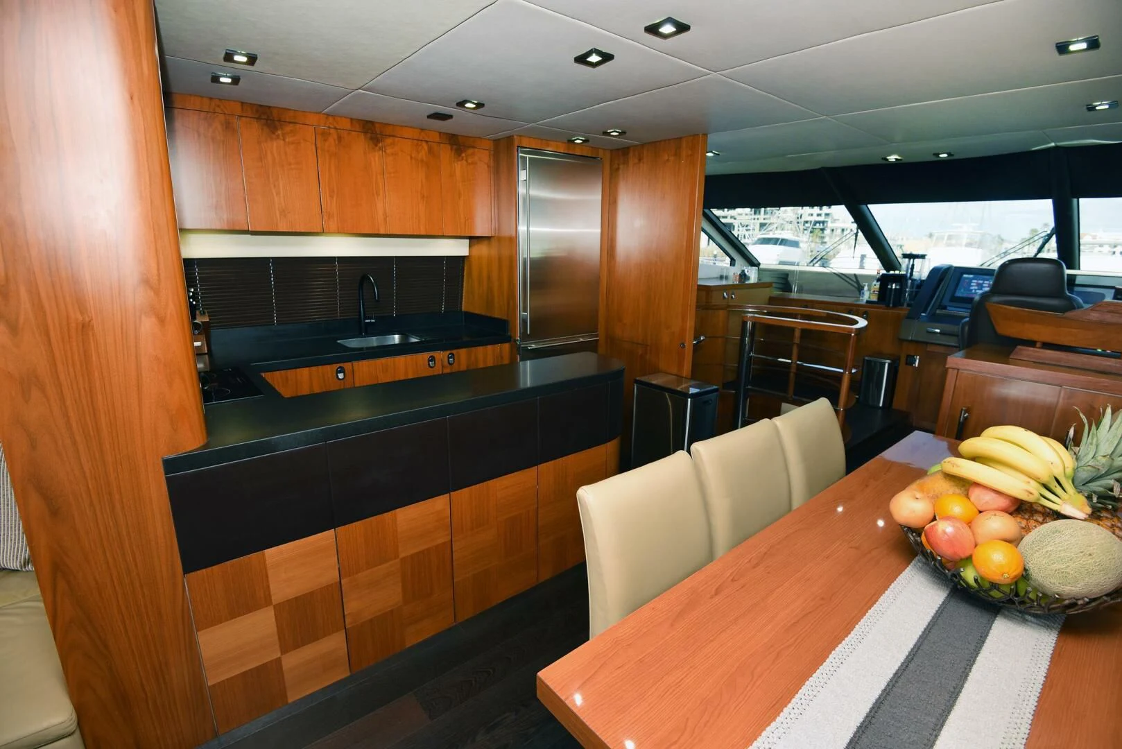 a kitchen with a table and chairs aboard SAVI II Yacht for Sale