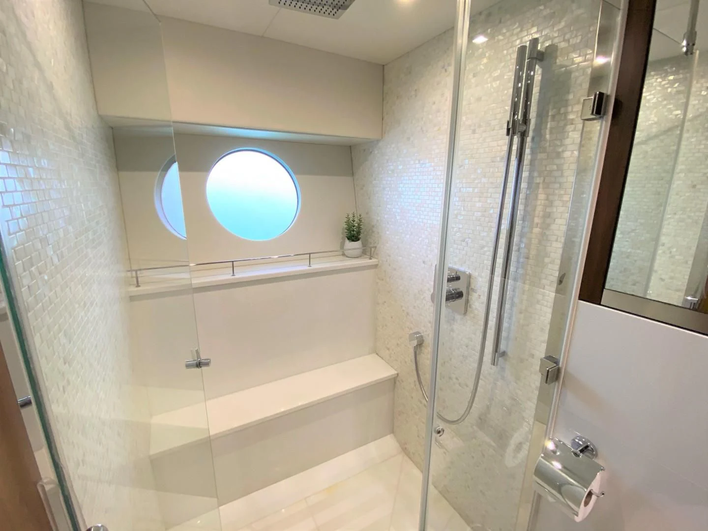 a bathroom with a glass shower aboard SAVI II Yacht for Sale
