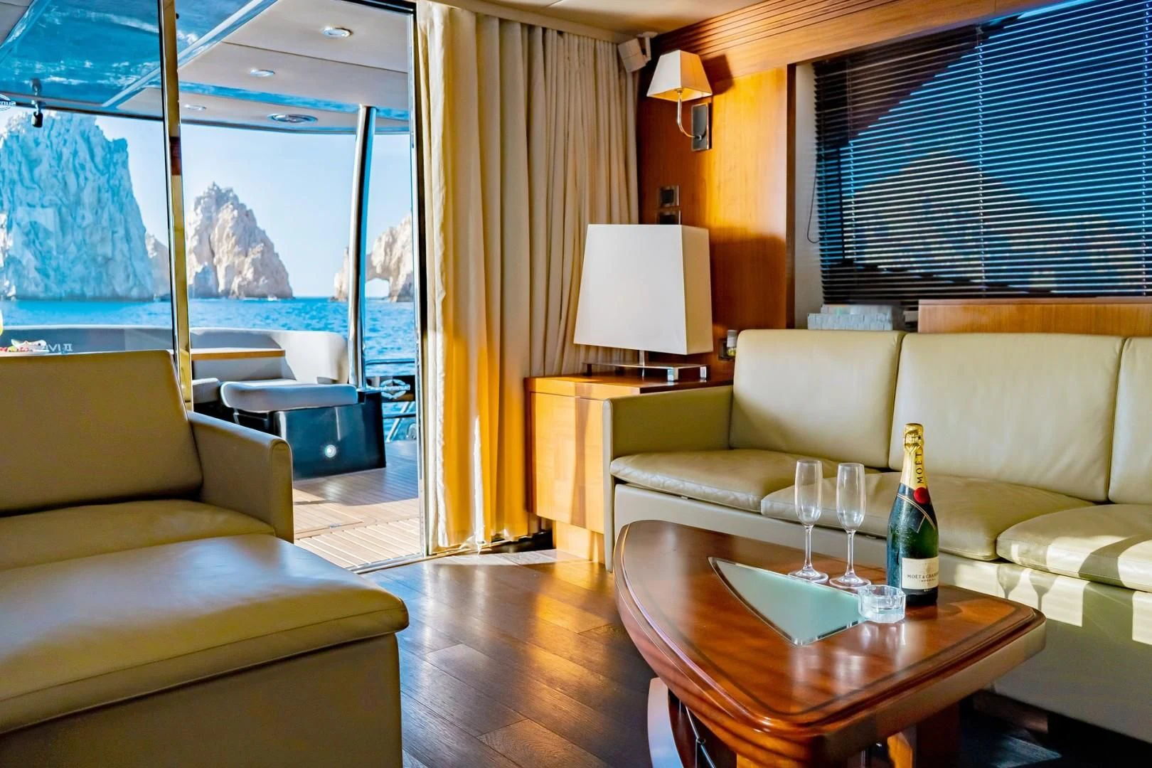 a room with a table and couches aboard SAVI II Yacht for Sale