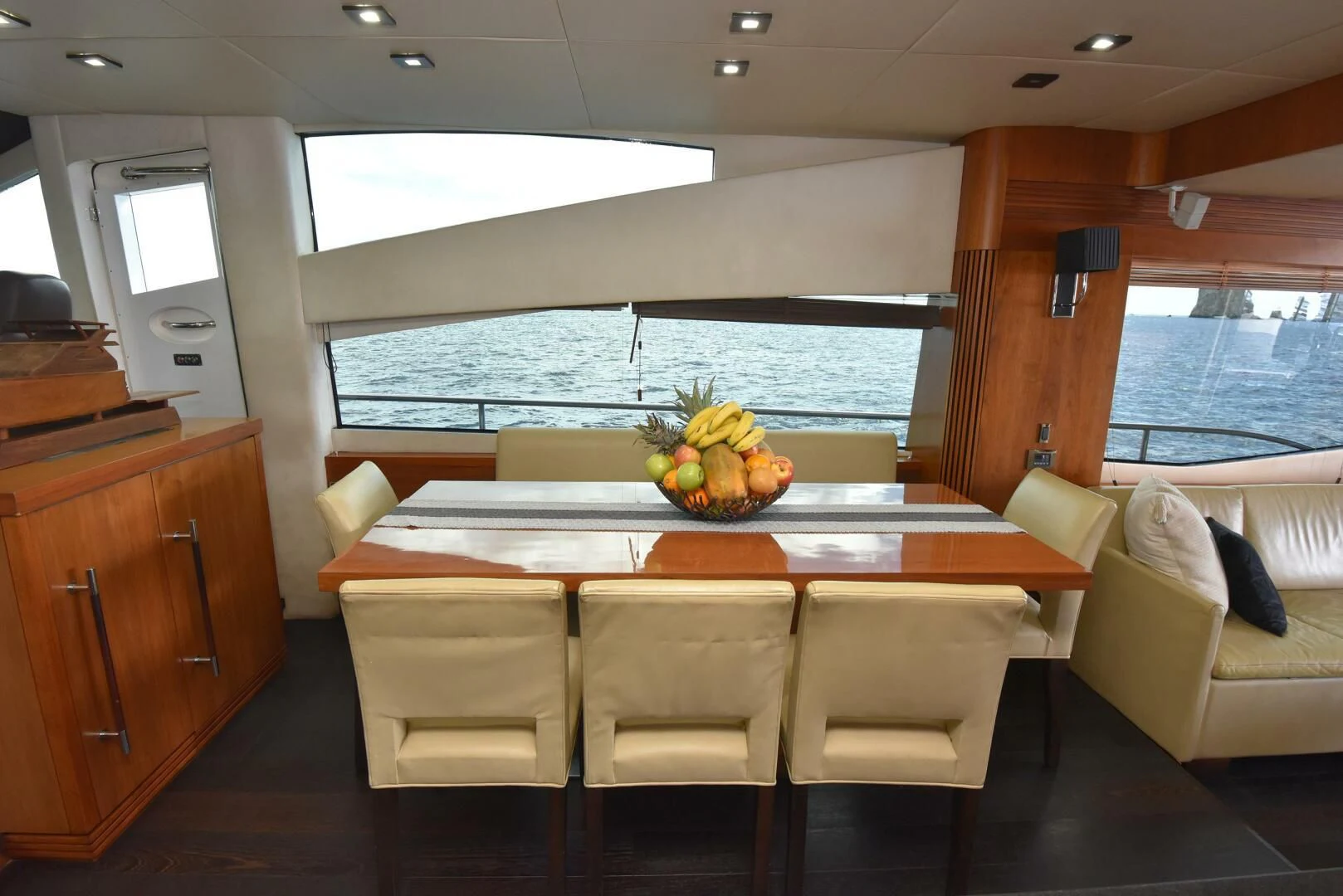 a room with a table and chairs aboard SAVI II Yacht for Sale