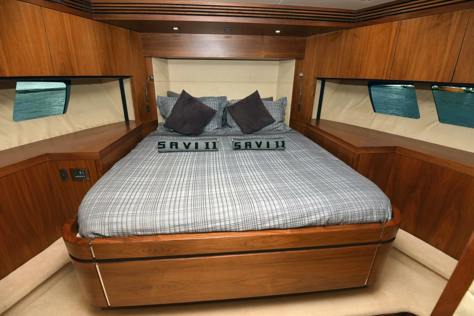 a bed with a white and black comforter aboard SAVI II Yacht for Sale