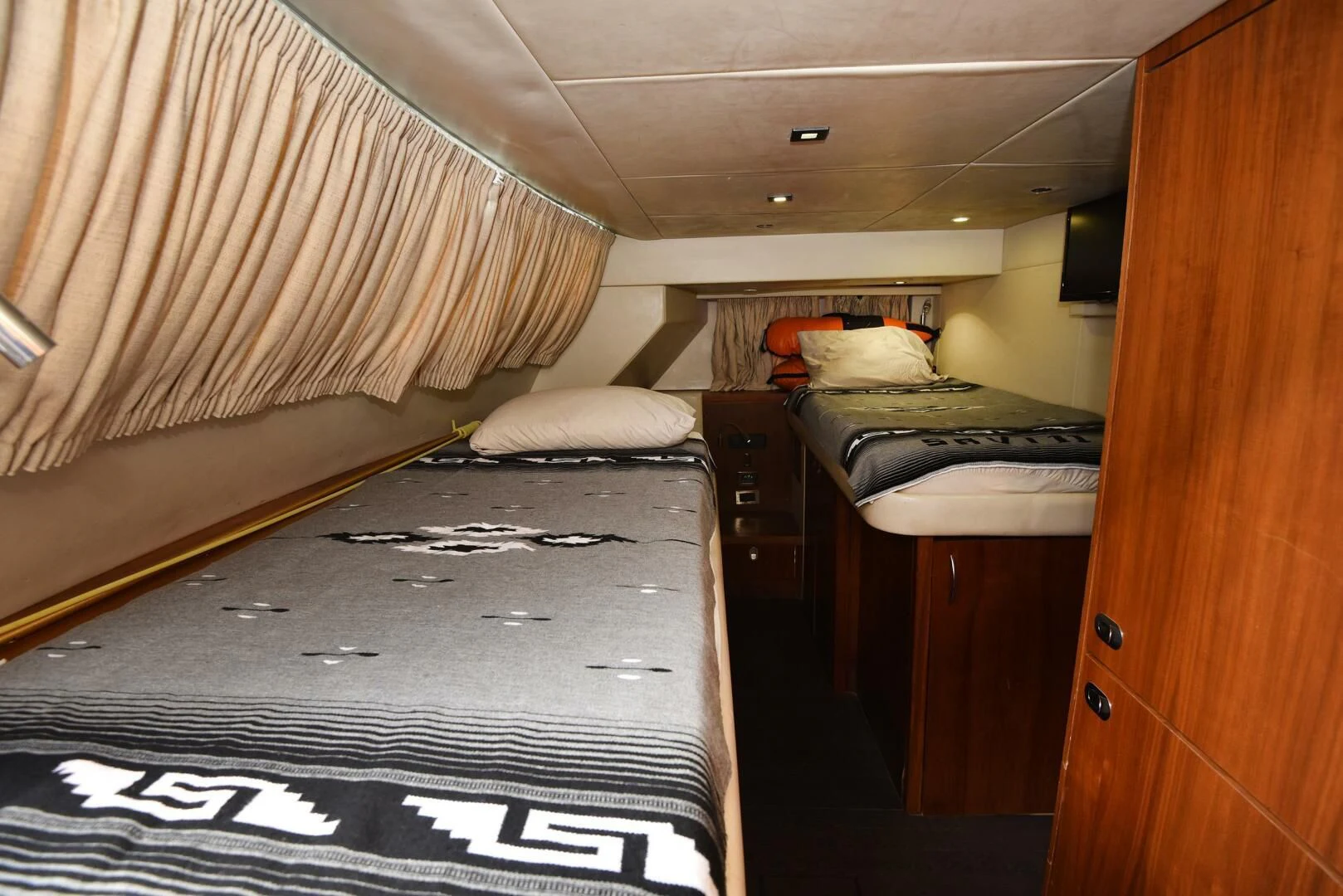 a room with two beds aboard SAVI II Yacht for Sale
