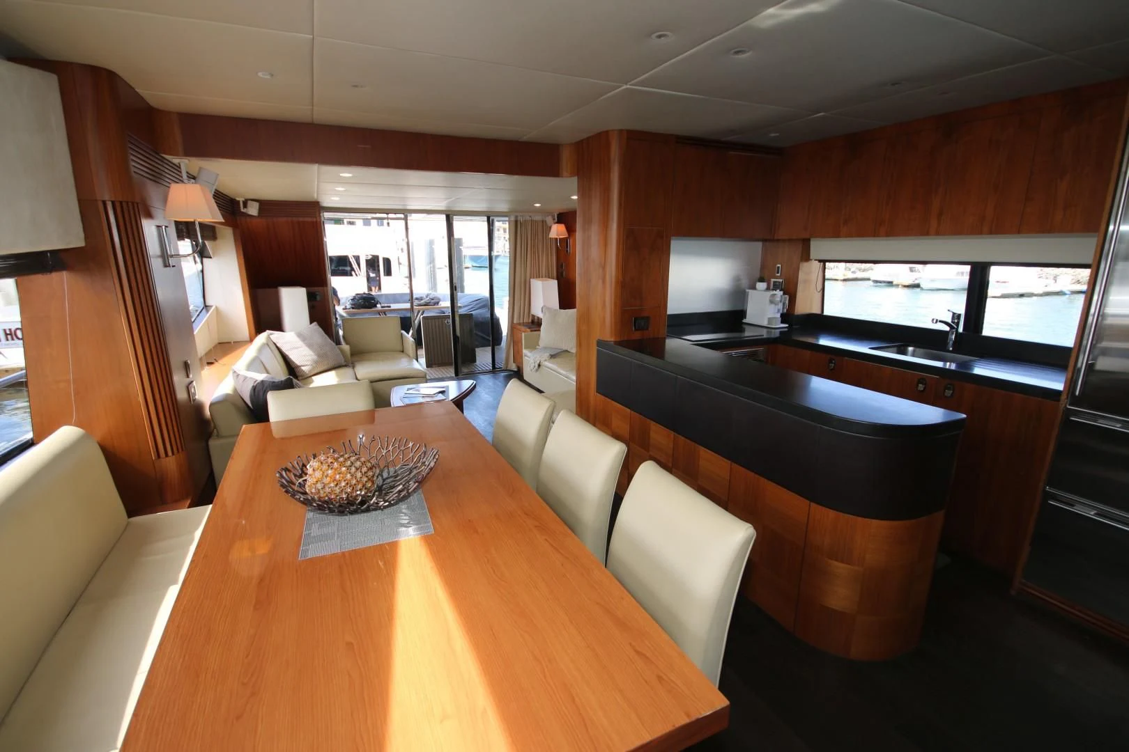 a large kitchen with a dining table aboard SAVI II Yacht for Sale