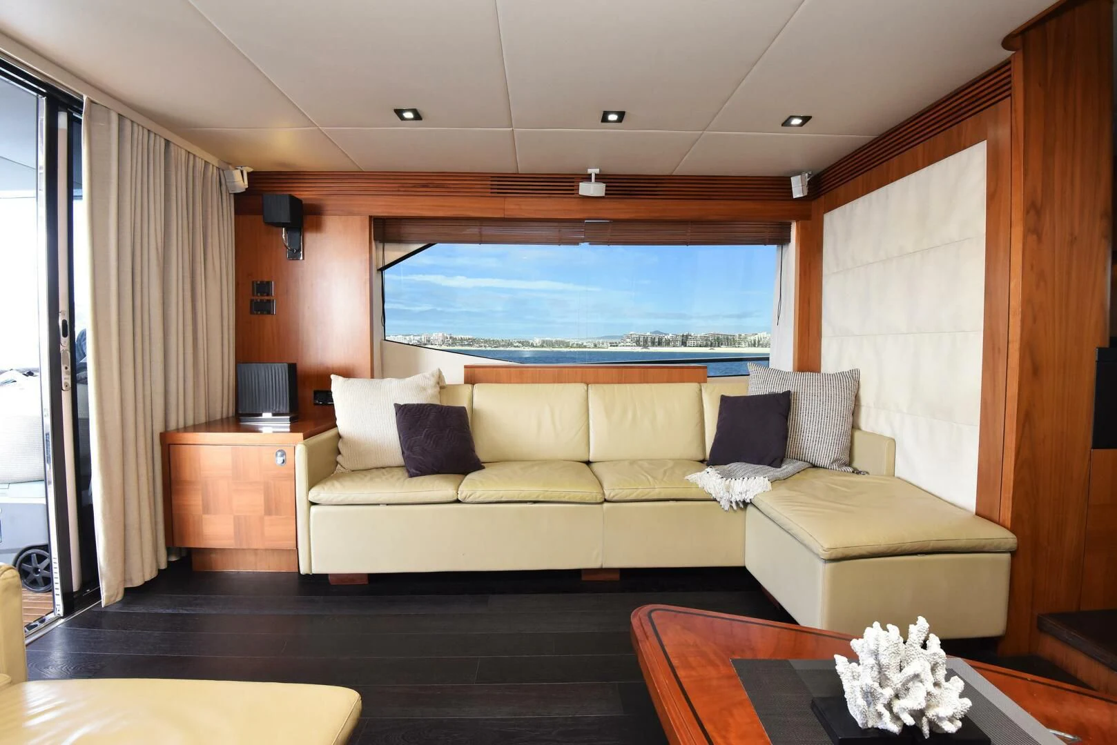 a living room with a large window aboard SAVI II Yacht for Sale