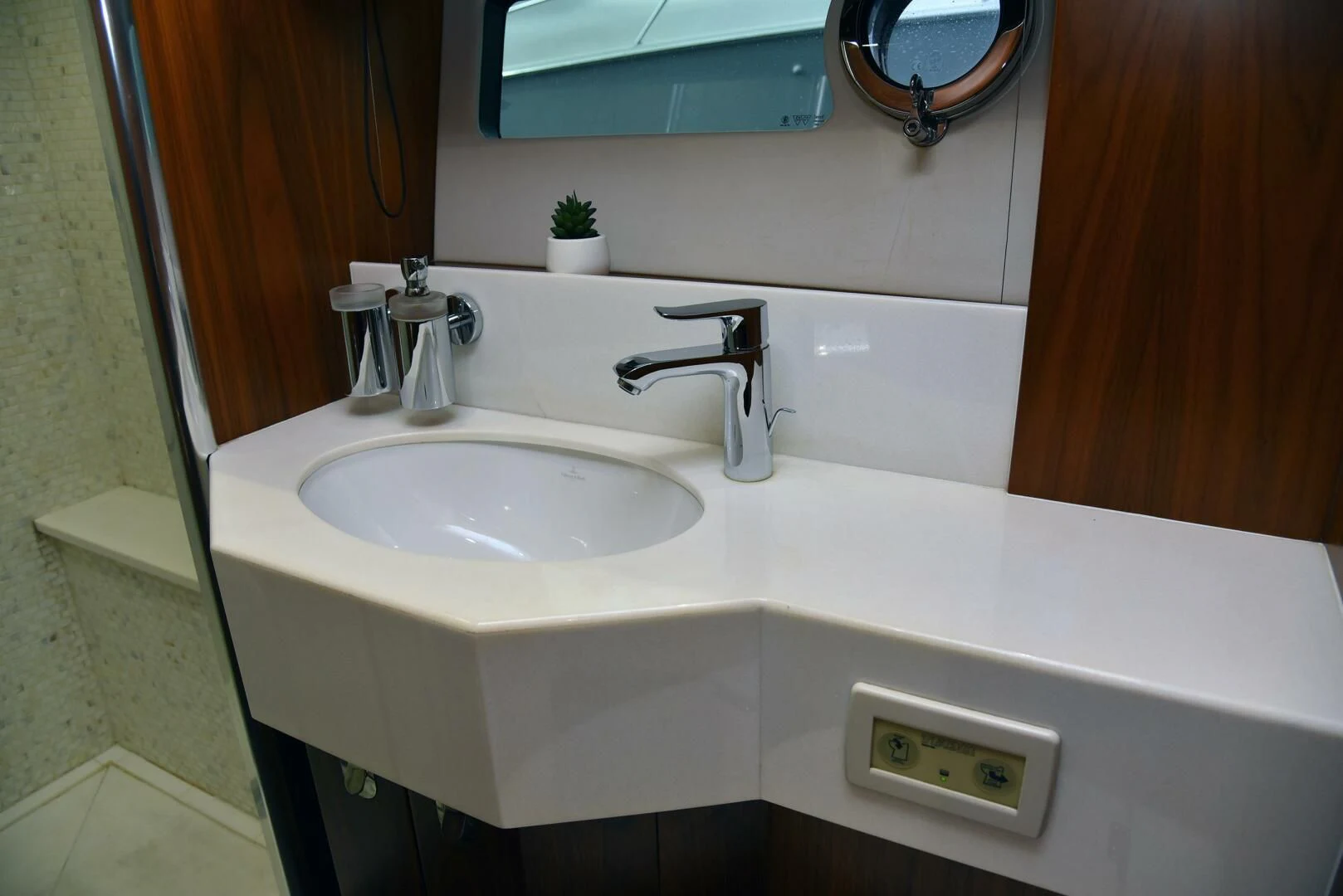a bathroom sink with a mirror above it aboard SAVI II Yacht for Sale