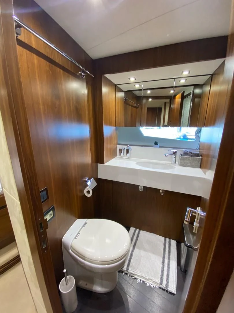 a bathroom with a toilet and sink aboard SAVI II Yacht for Sale
