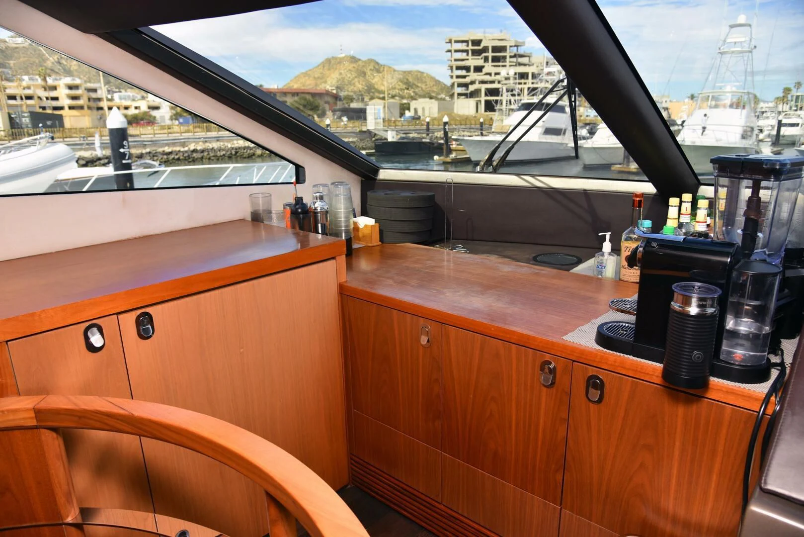 a bar with a view of the city below aboard SAVI II Yacht for Sale