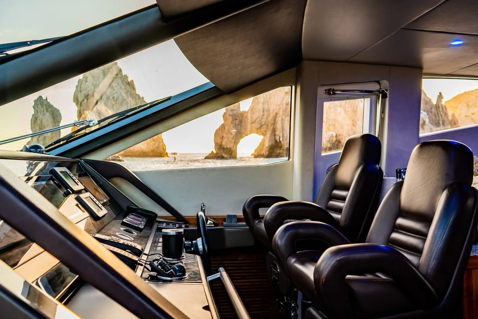 inside of a vehicle with a view of the mountains and trees aboard SAVI II Yacht for Sale