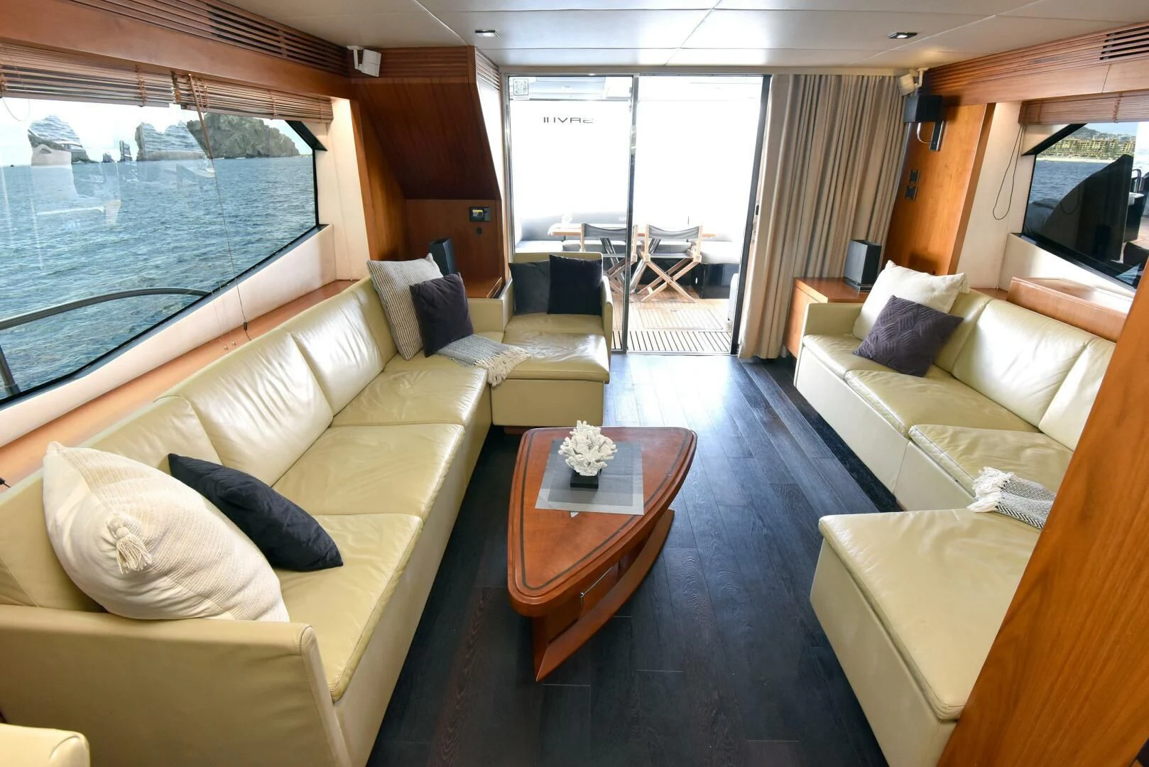 a living room with a large window aboard SAVI II Yacht for Sale