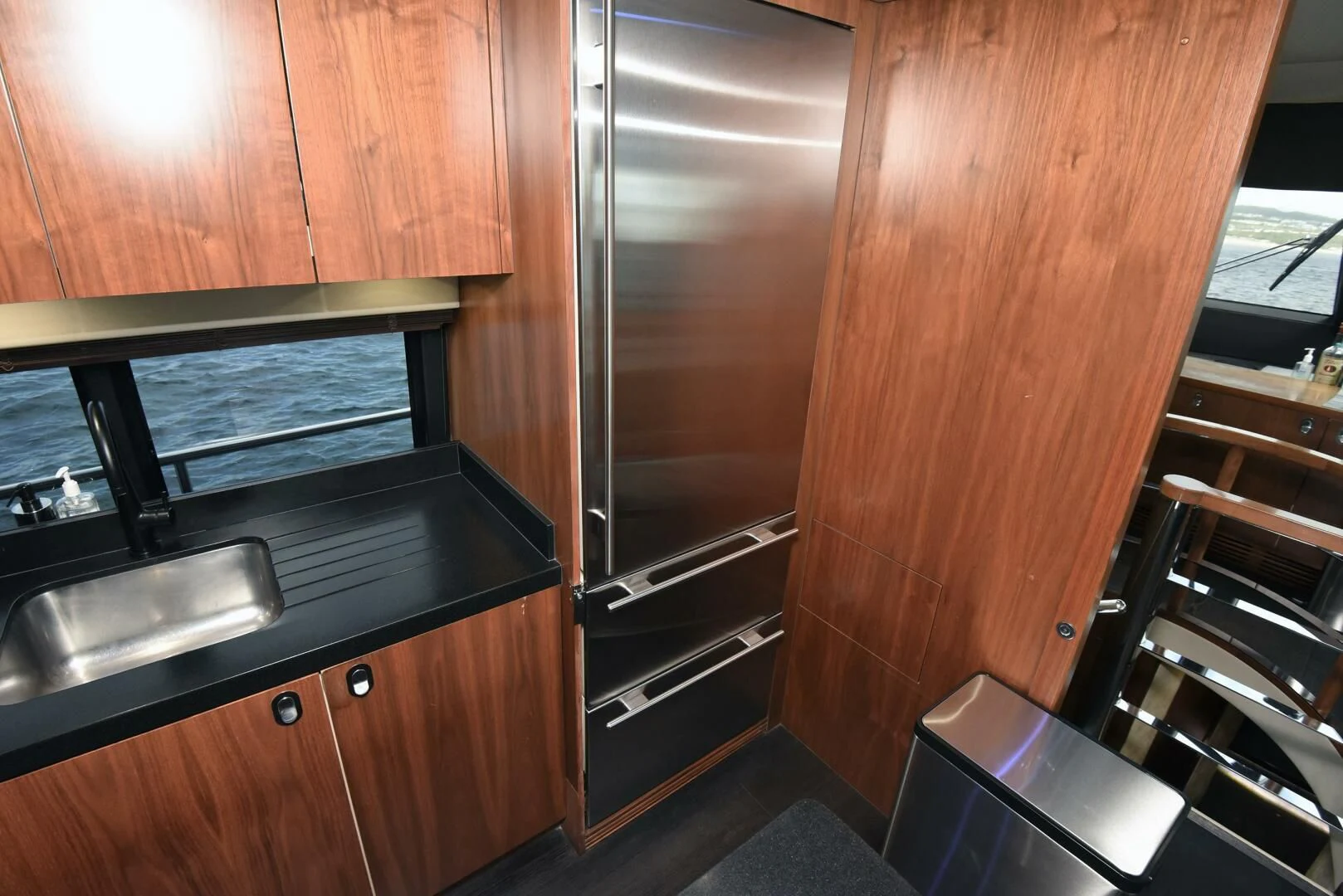 a kitchen with wooden cabinets aboard SAVI II Yacht for Sale