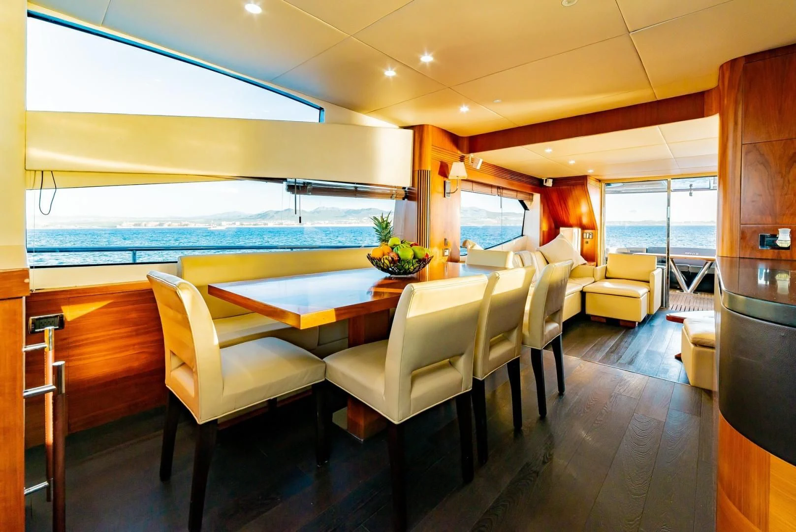 a room with a table chairs and a large window aboard SAVI II Yacht for Sale