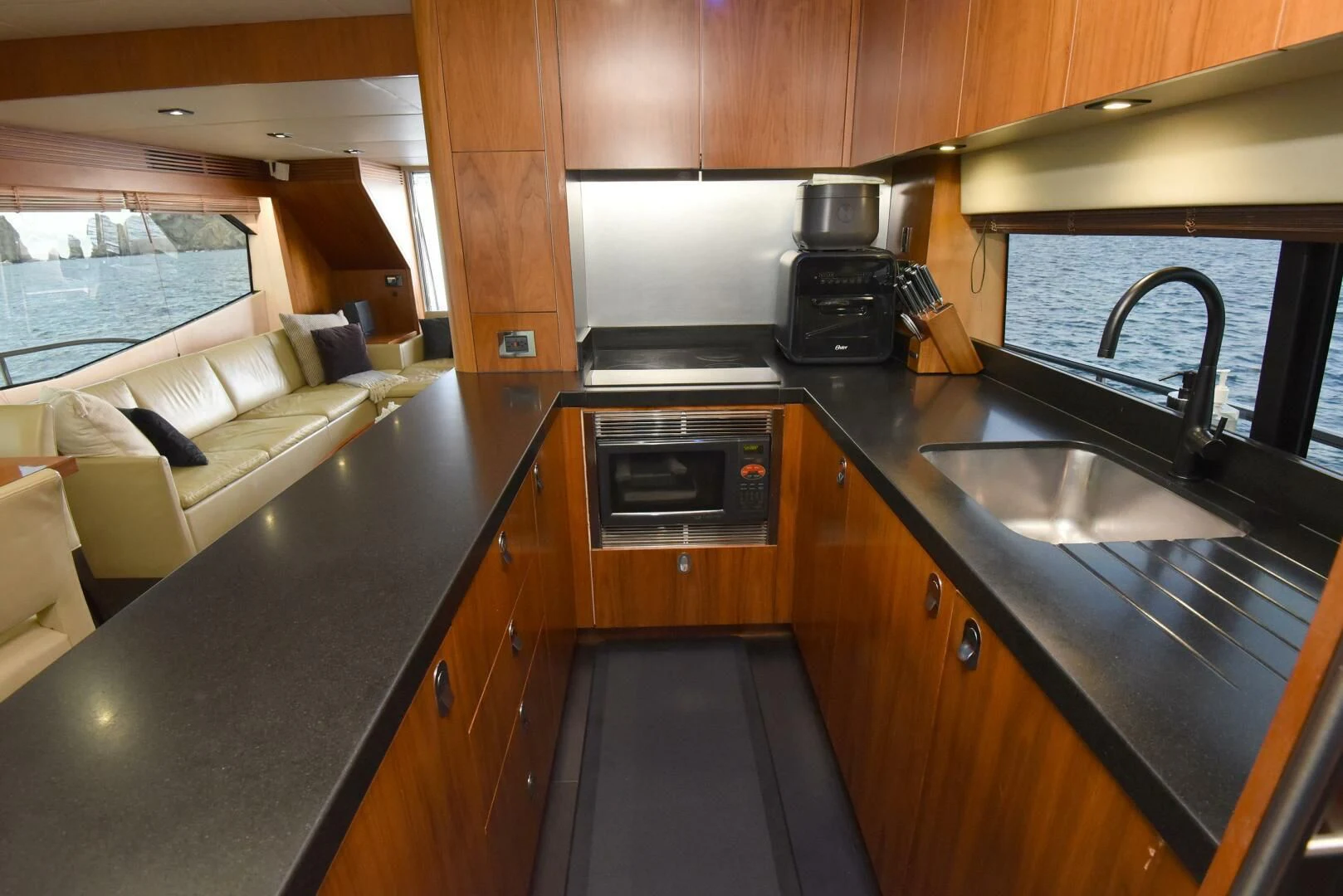a kitchen with a couch and a sink aboard SAVI II Yacht for Sale