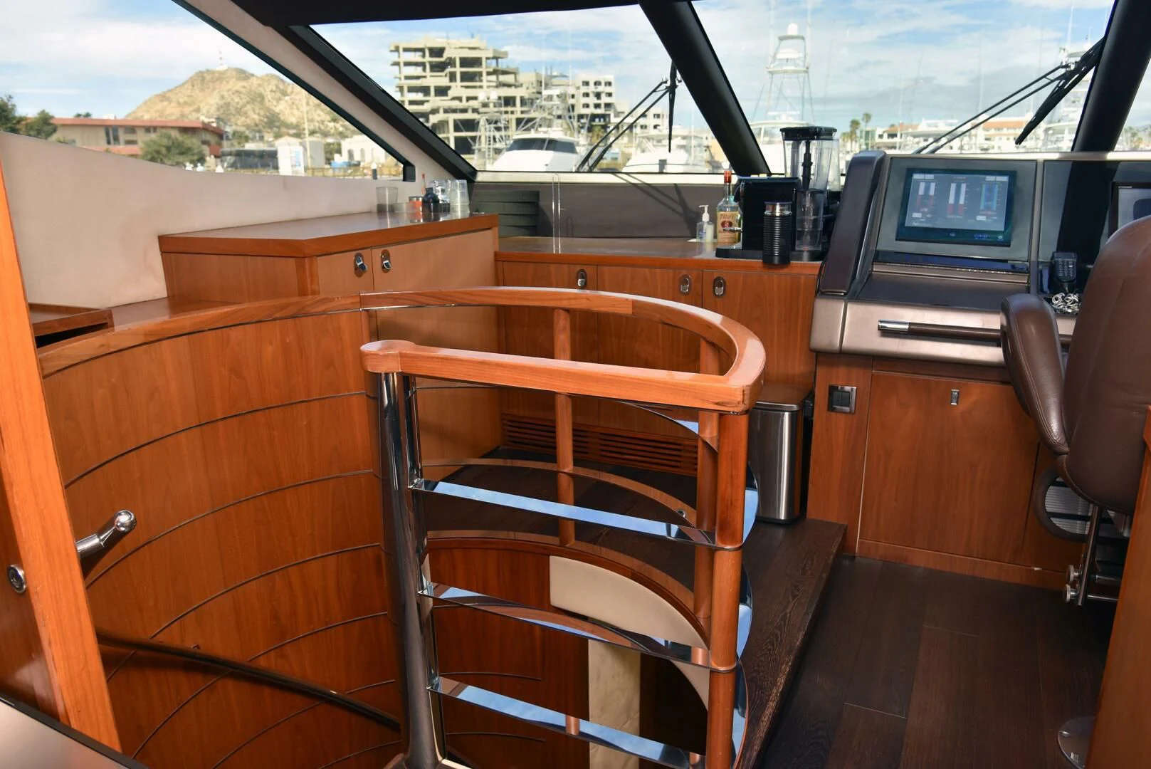 a room with a chair and a desk with a computer on it aboard SAVI II Yacht for Sale