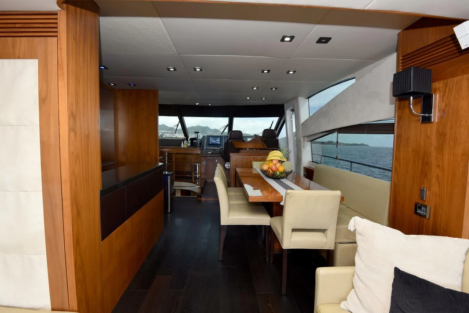 a room with a table and chairs aboard SAVI II Yacht for Sale