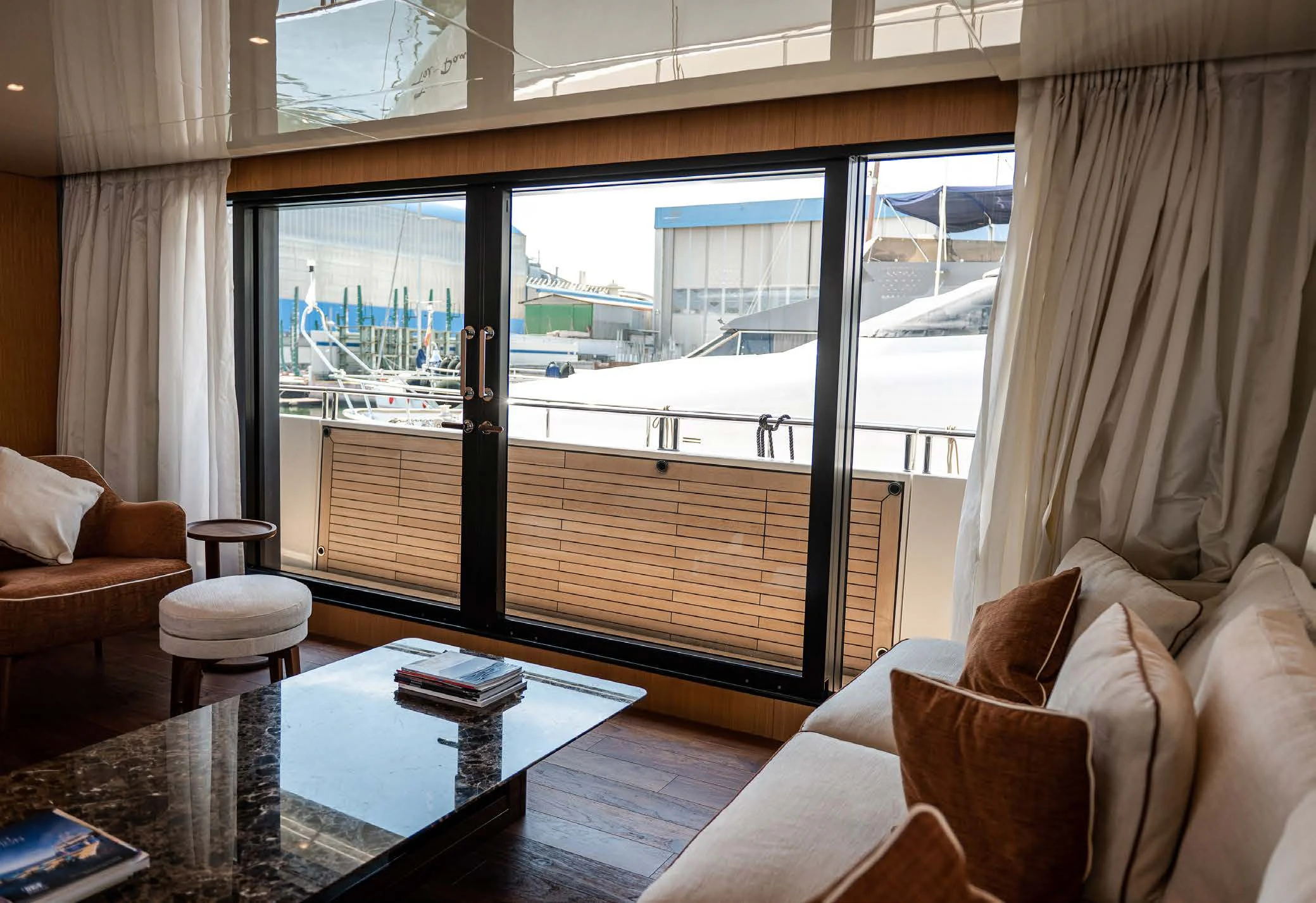 a living room with a large window aboard VISSOTTA Yacht for Sale
