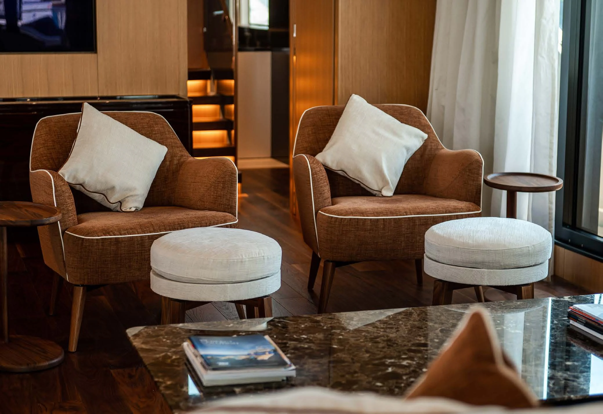 a living room with a table and chairs aboard VISSOTTA Yacht for Sale