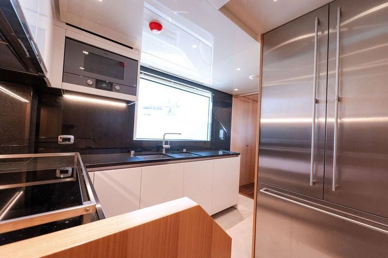a kitchen with stainless steel appliances aboard VISSOTTA Yacht for Sale