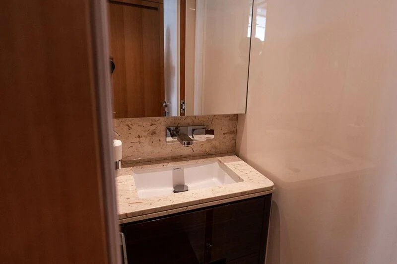 a bathroom with a sink and a mirror aboard VISSOTTA Yacht for Sale