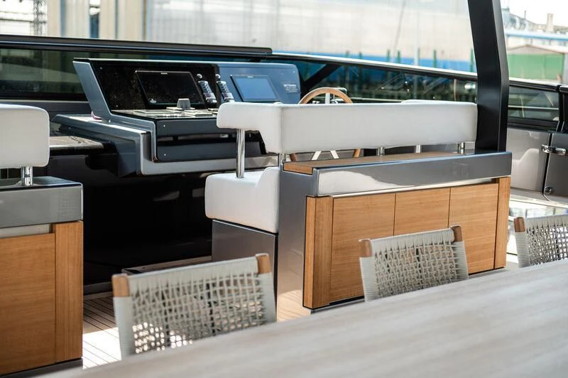 a room with a table and chairs aboard VISSOTTA Yacht for Sale