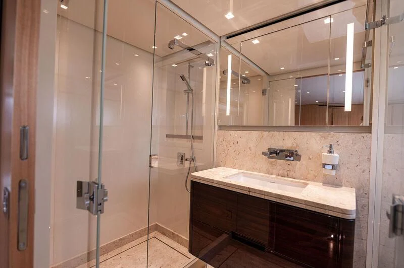 a bathroom with a large mirror aboard VISSOTTA Yacht for Sale