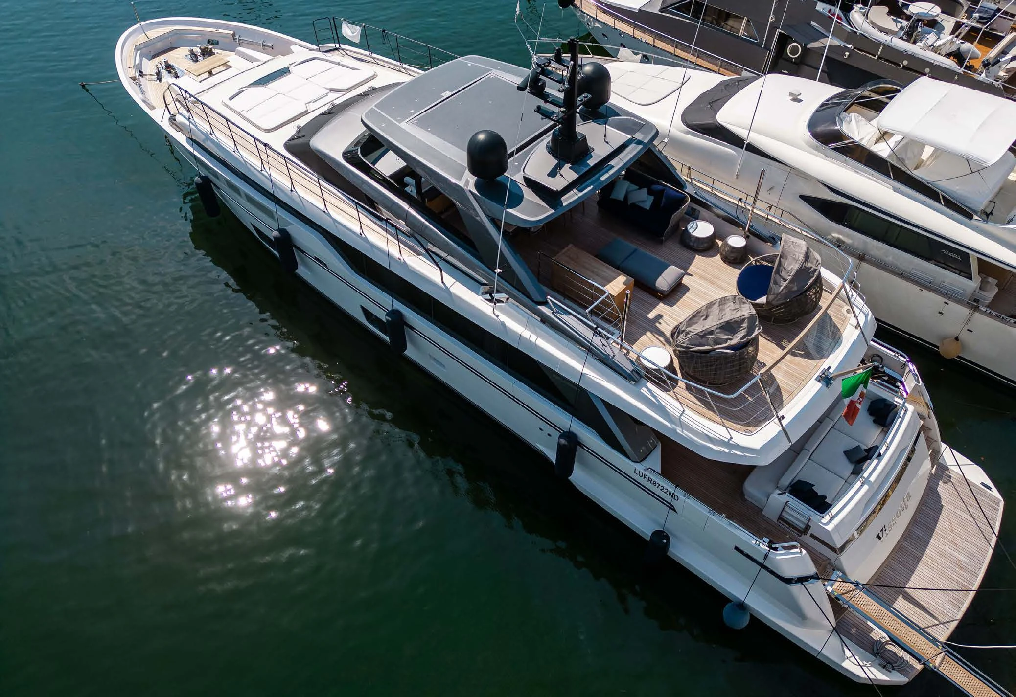 a large white boat with a large ship on it aboard VISSOTTA Yacht for Sale