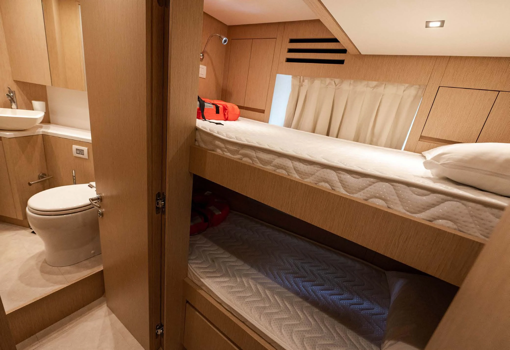 a bathroom with two beds aboard VISSOTTA Yacht for Sale