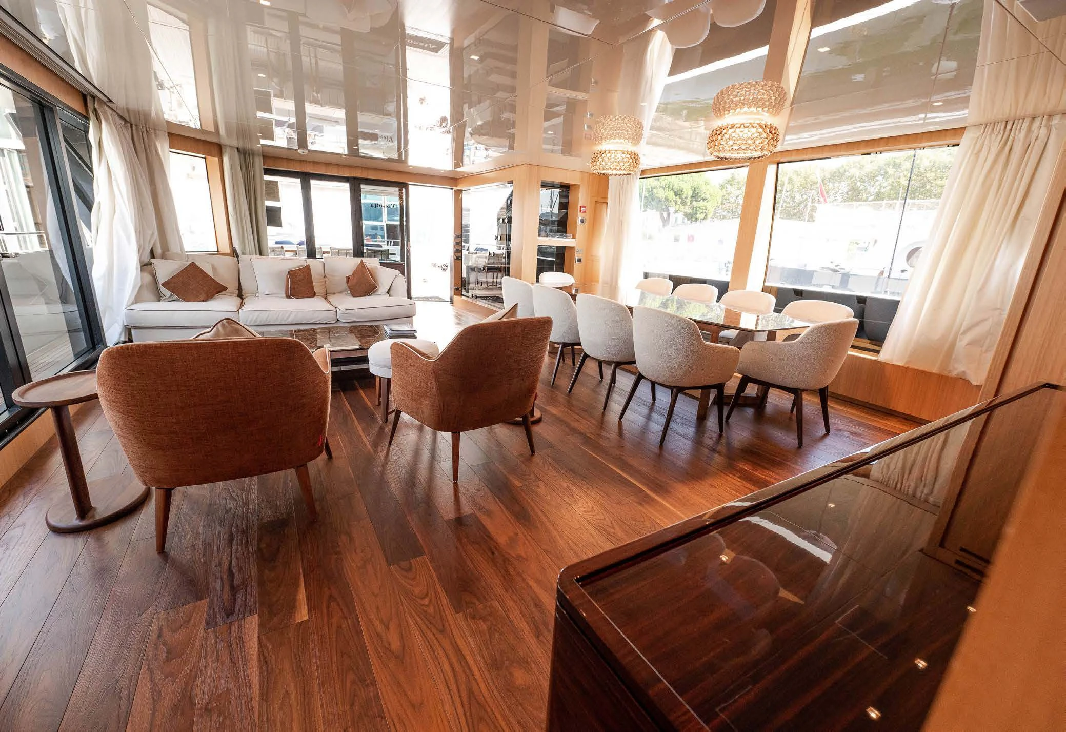 a room with a table chairs and a window aboard VISSOTTA Yacht for Sale