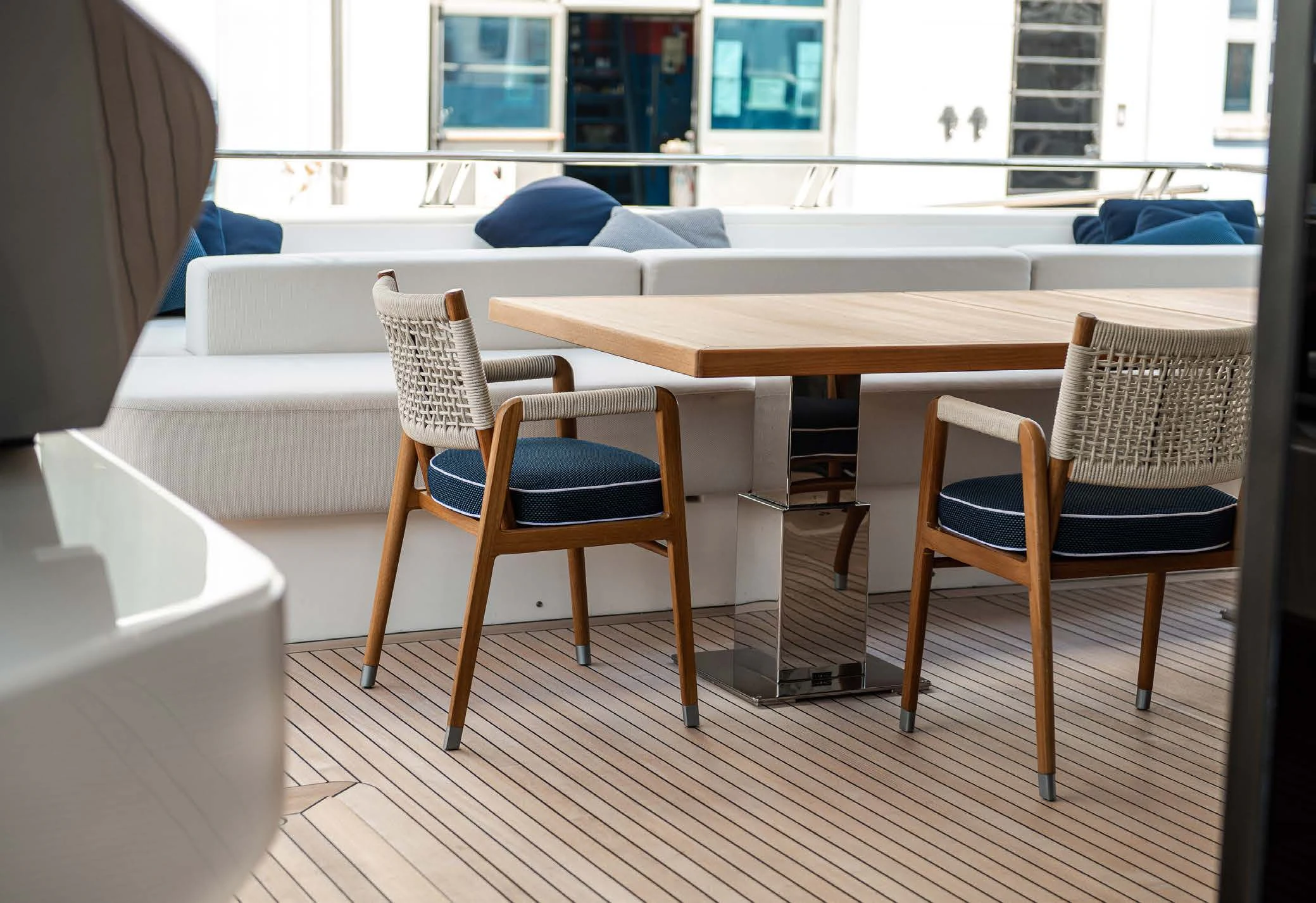 a table and chairs in a room aboard VISSOTTA Yacht for Sale
