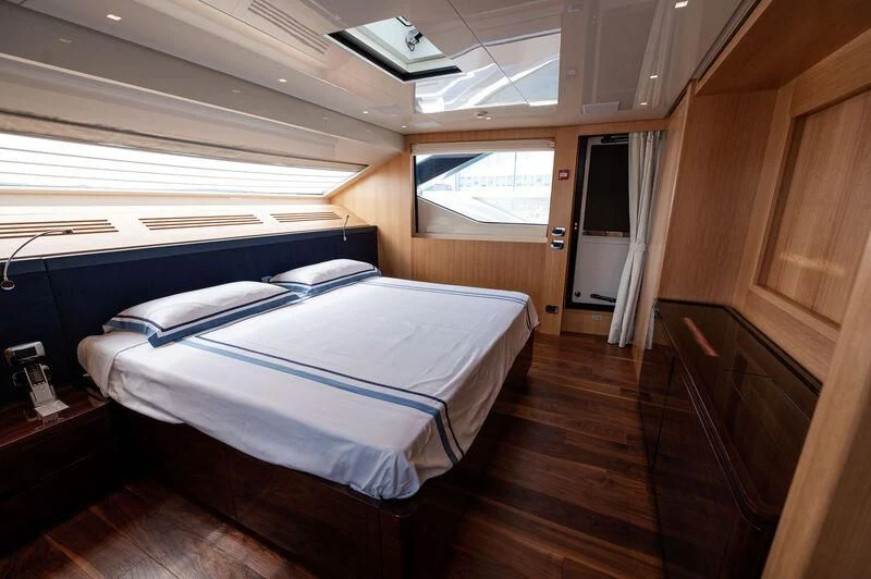 a bed in a room aboard VISSOTTA Yacht for Sale