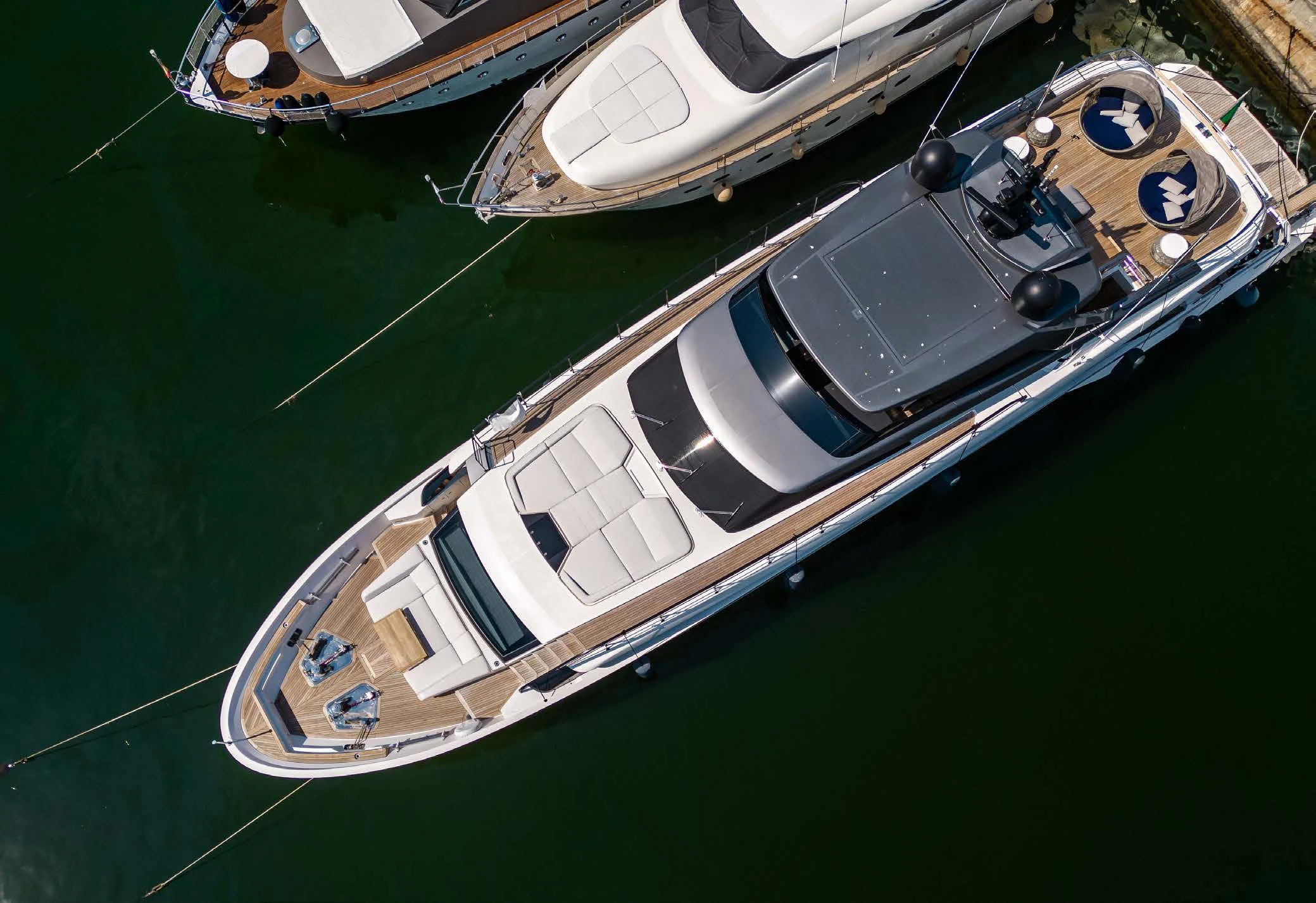 a group of boats on a green field aboard VISSOTTA Yacht for Sale