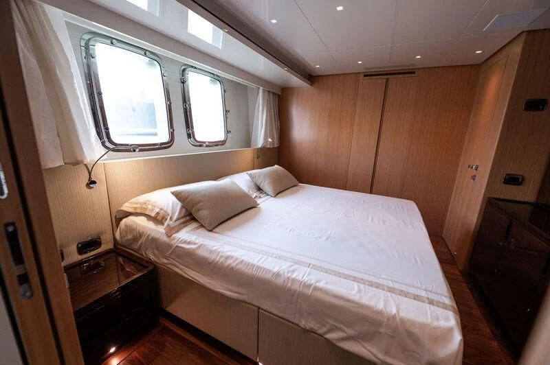 a bed in a room aboard VISSOTTA Yacht for Sale