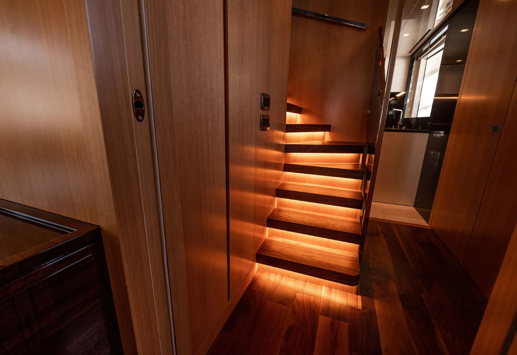 a wooden staircase in a room aboard VISSOTTA Yacht for Sale