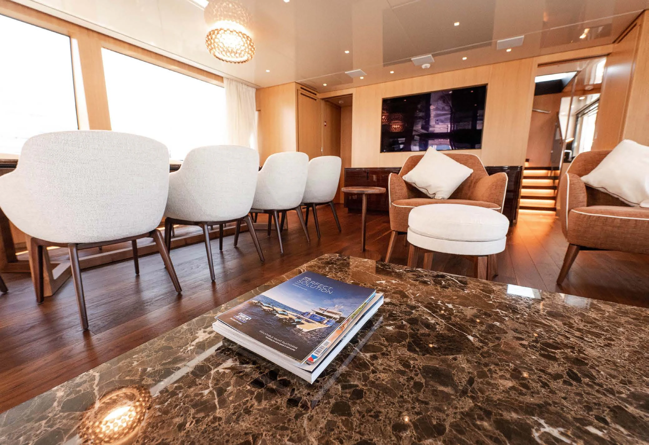 a room with chairs and a rug aboard VISSOTTA Yacht for Sale