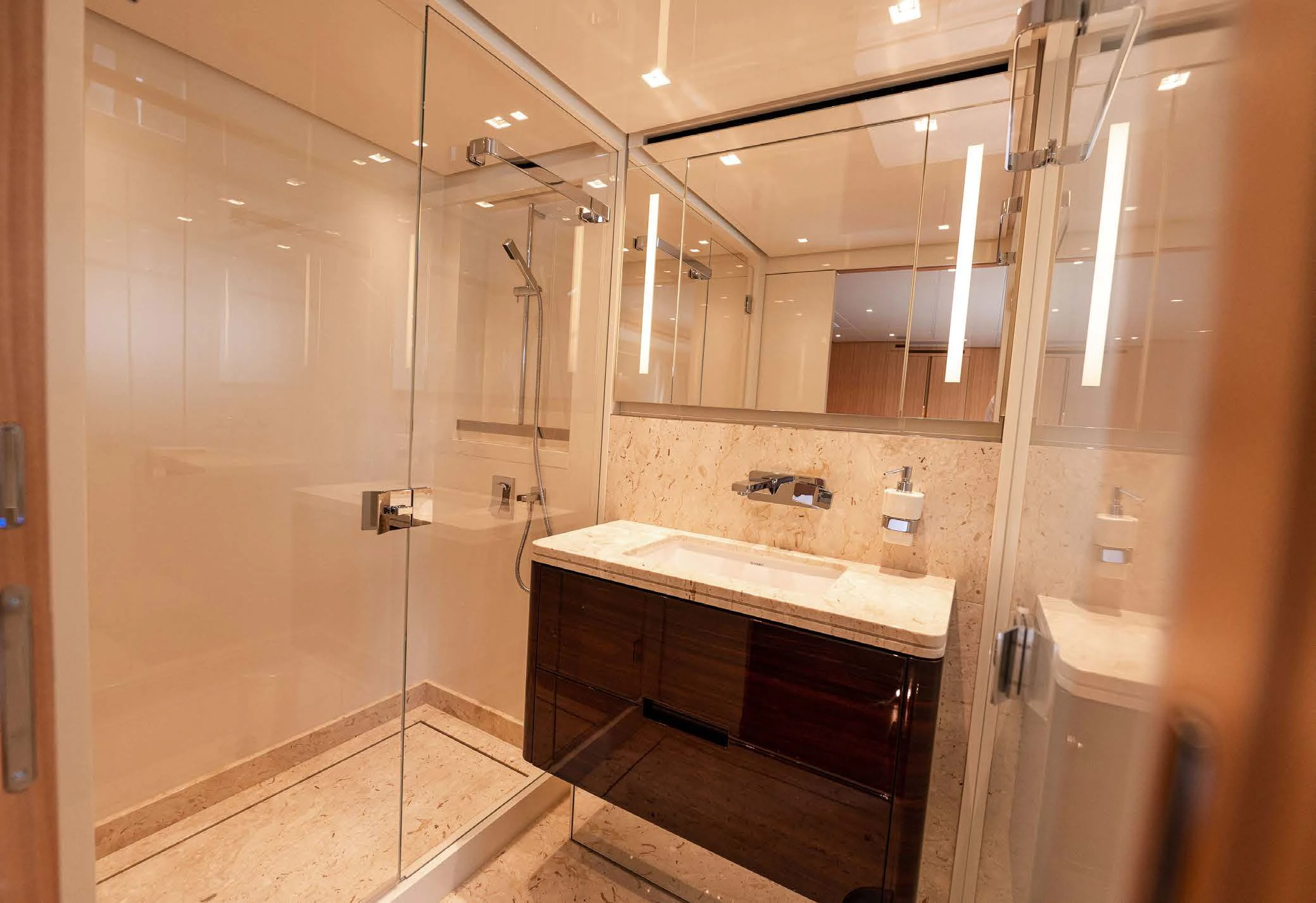 a bathroom with a large mirror aboard VISSOTTA Yacht for Sale