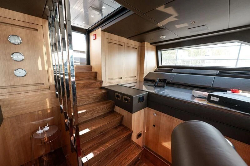 a kitchen with wooden cabinets aboard VISSOTTA Yacht for Sale