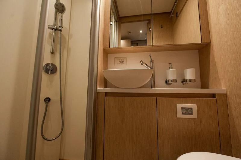 a bathroom with a sink and a shower aboard VISSOTTA Yacht for Sale