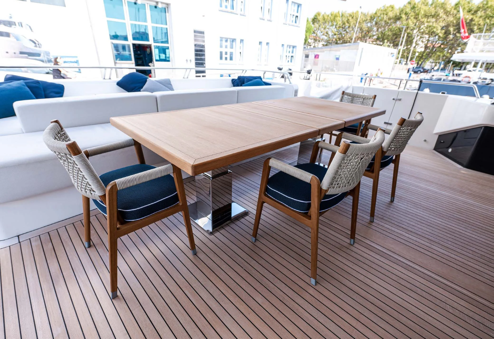 a table and chairs on a deck aboard VISSOTTA Yacht for Sale