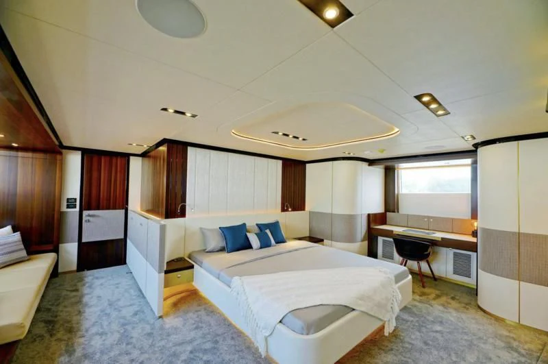 a room with a bed and a desk aboard BOKE 125 Yacht for Sale