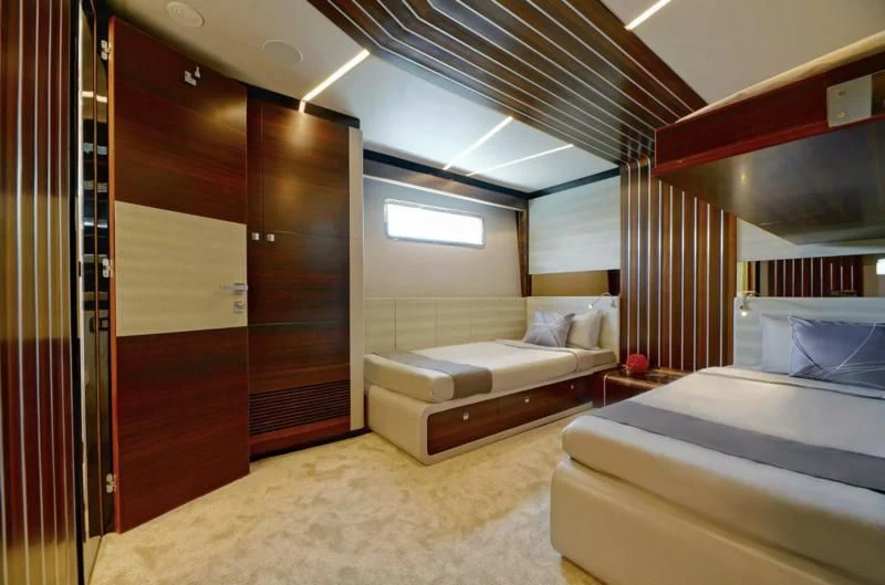 a room with a bed and a couch aboard BOKE 125 Yacht for Sale