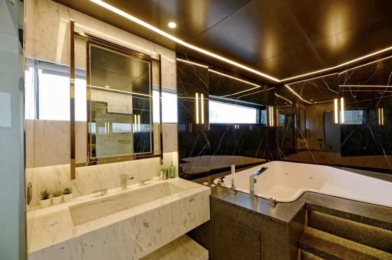 a bathroom with a large tub aboard BOKE 125 Yacht for Sale