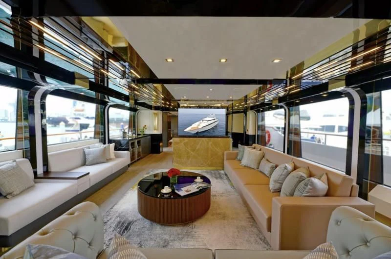 a living room with a large window aboard BOKE 125 Yacht for Sale