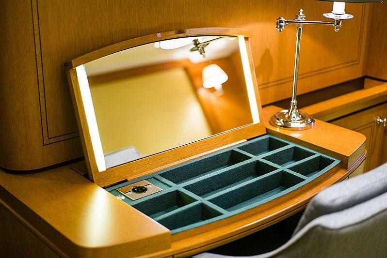 a tv on a table aboard WISP Yacht for Sale
